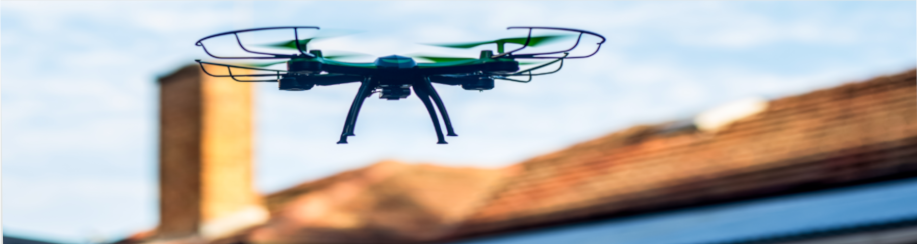 Drone inspecting roof